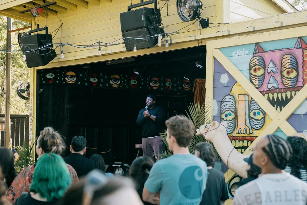 Afternoon crowd packed in under the murals at The Far Out Lounge